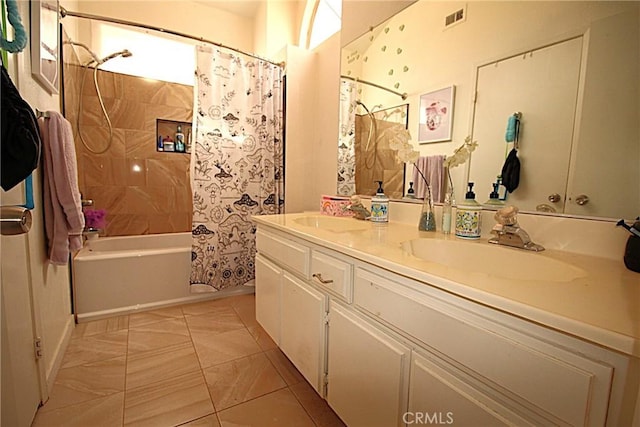 bathroom with double vanity, shower / bath combination with curtain, visible vents, and a sink