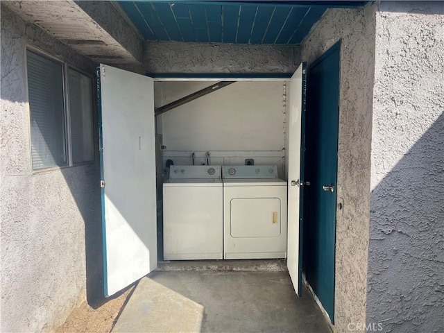 laundry area featuring washing machine and dryer and laundry area