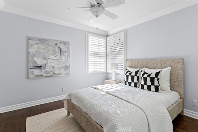 bedroom featuring baseboards, ceiling fan, hardwood / wood-style floors, and crown molding