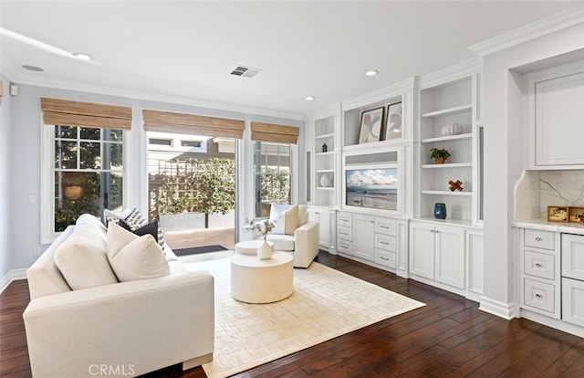 sitting room featuring recessed lighting, visible vents, dark wood finished floors, and ornamental molding