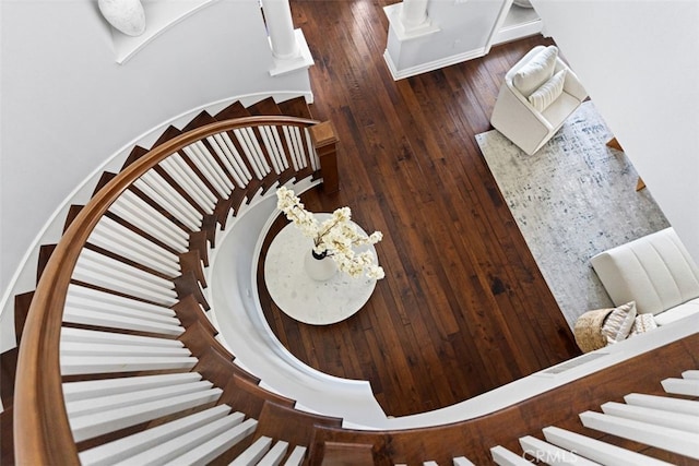 stairway with wood finished floors