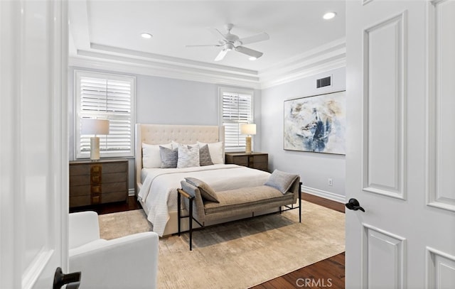 bedroom featuring recessed lighting, wood finished floors, visible vents, and baseboards