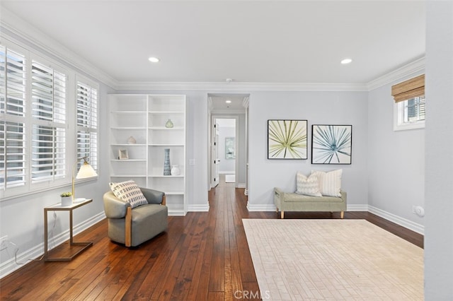 living area featuring ornamental molding, recessed lighting, hardwood / wood-style flooring, and baseboards