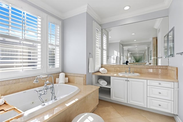 full bath with a tub with jets, vanity, ornamental molding, and tile patterned floors