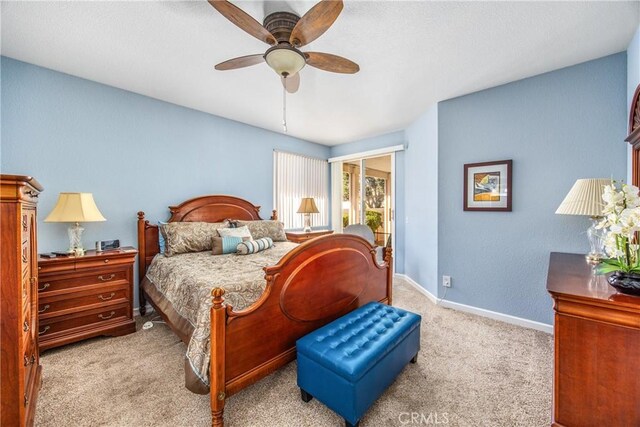 carpeted bedroom featuring a ceiling fan and baseboards