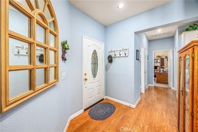 5855 Myrtle Beach Dr, Banning, CA 92220 - entrance foyer with baseboards, light wood-style floors, and recessed lighting