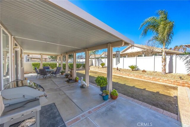 view of patio featuring outdoor dining area and a fenced backyard