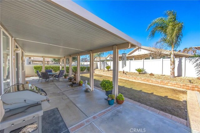 5855 Myrtle Beach Dr, Banning, CA 92220 - fenced backyard featuring a patio area and outdoor dining space