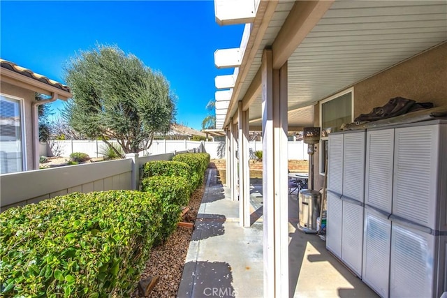 view of patio featuring fence