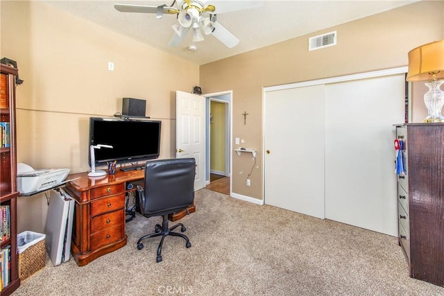 office featuring ceiling fan, carpet floors, and visible vents