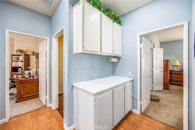 5855 Myrtle Beach Dr, Banning, CA 92220 - corridor featuring light wood-style floors, an office area, and baseboards
