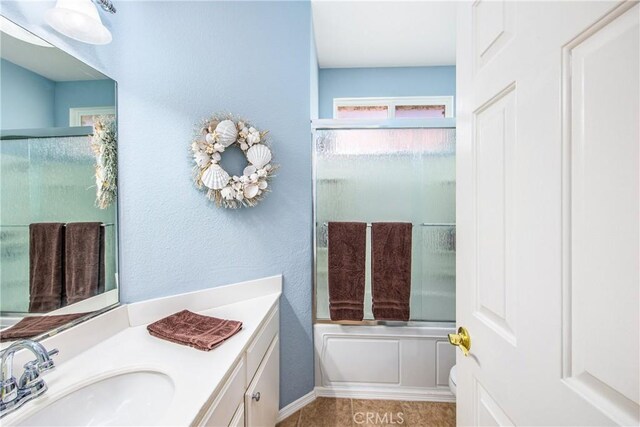 5855 Myrtle Beach Dr, Banning, CA 92220 - bathroom featuring vanity, enclosed tub / shower combo, and tile patterned floors