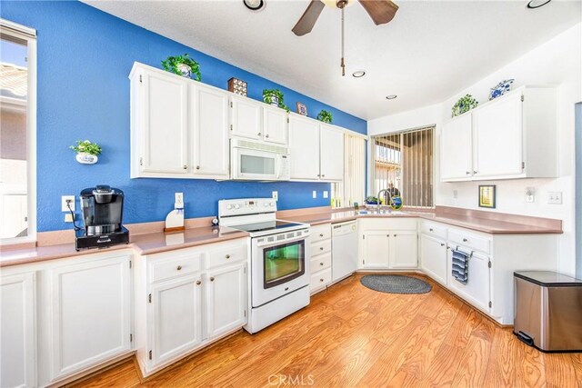 5855 Myrtle Beach Dr, Banning, CA 92220 - kitchen featuring white appliances, white cabinets, light wood-style flooring, ceiling fan, and recessed lighting