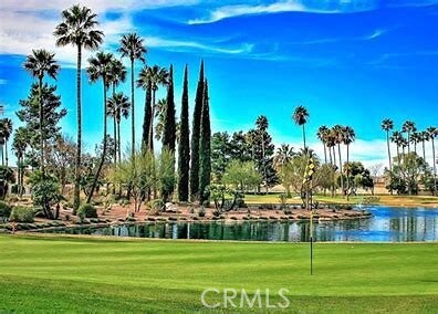 5855 Myrtle Beach Dr, Banning, CA 92220 - view of property's community with a lawn, golf course view, and a water view