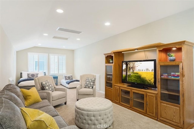 living room with vaulted ceiling, recessed lighting, visible vents, and light colored carpet