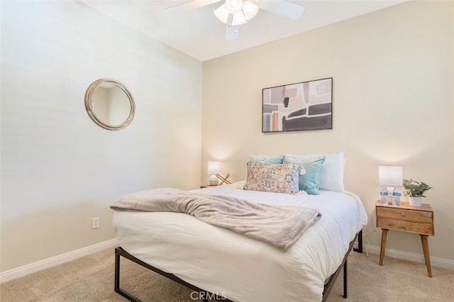 bedroom with ceiling fan, carpet flooring, and baseboards