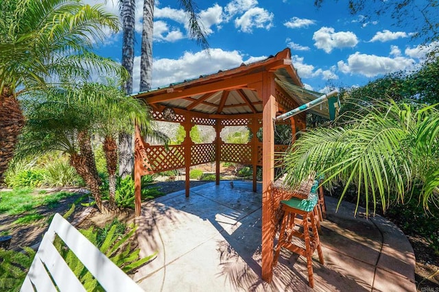 view of patio / terrace featuring fence and a gazebo