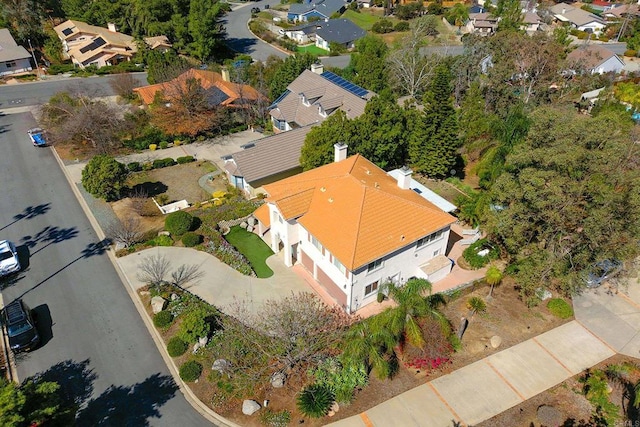 birds eye view of property with a residential view