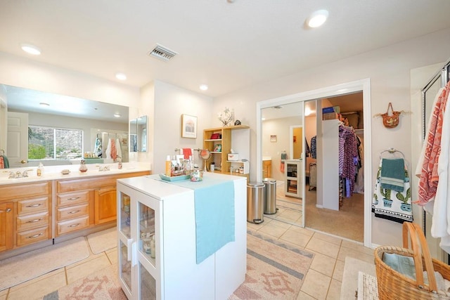 kitchen featuring recessed lighting, visible vents, light countertops, and light tile patterned flooring