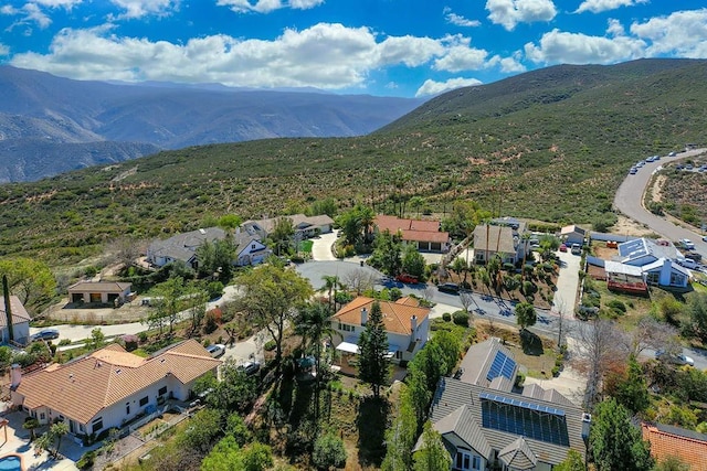 drone / aerial view featuring a residential view and a mountain view