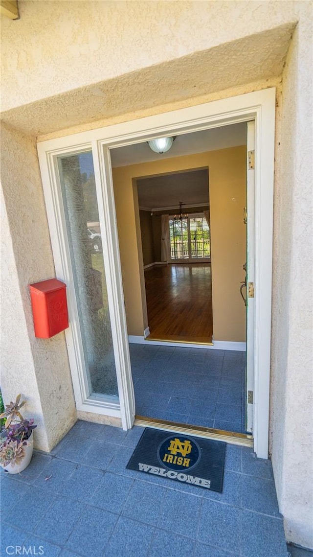 doorway to property with stucco siding