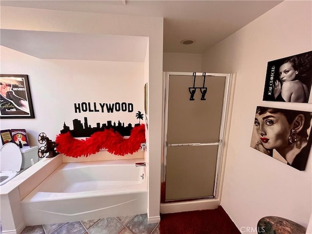 full bathroom with a garden tub, tile patterned flooring, and a shower stall