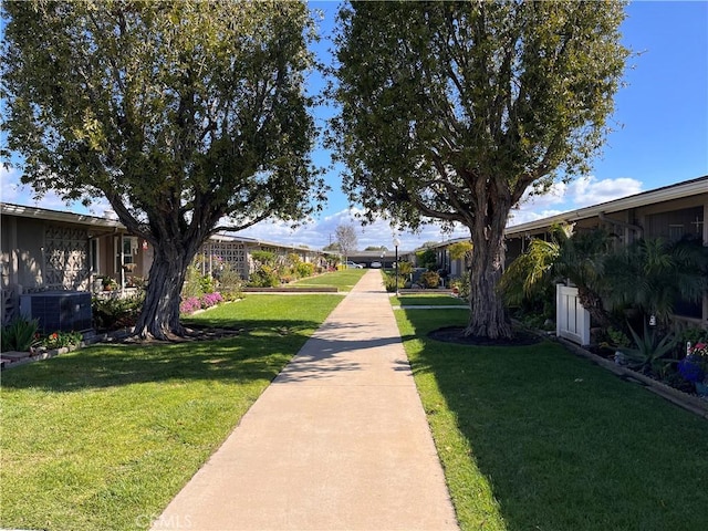 view of home's community featuring a lawn