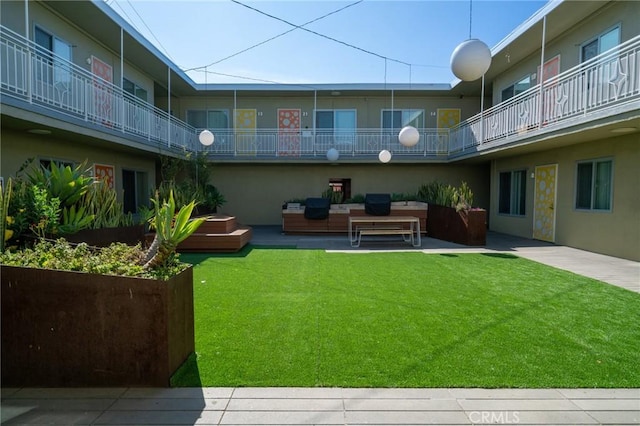 exterior space with outdoor lounge area and a patio