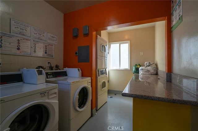 shared laundry area featuring electric panel, washer and clothes dryer, and stacked washer / dryer