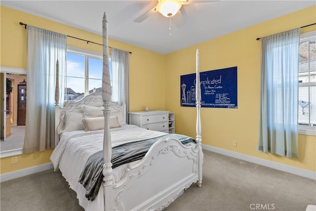 bedroom with carpet flooring, a ceiling fan, and baseboards