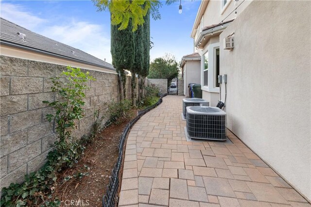 view of patio featuring a fenced backyard and central air condition unit