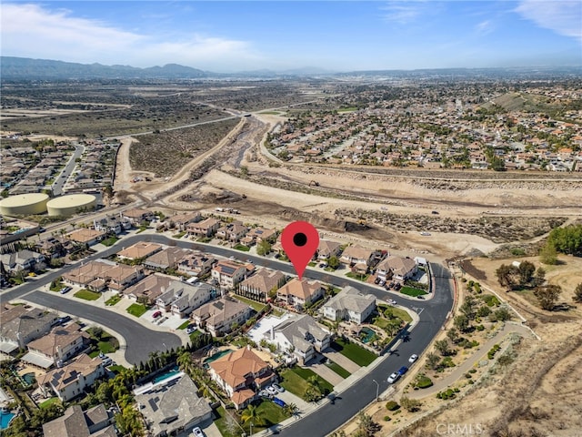 drone / aerial view with a residential view and a mountain view