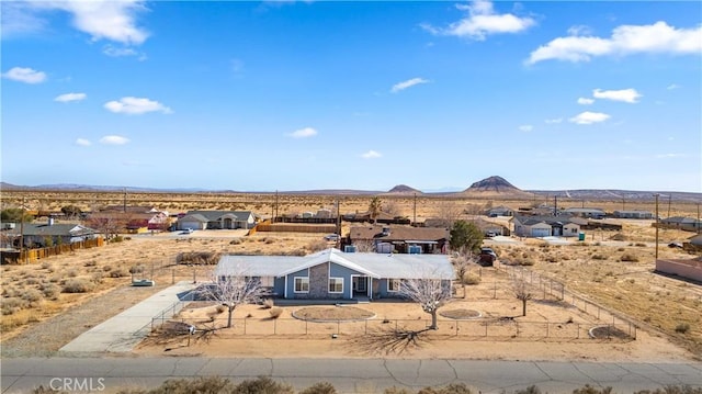 bird's eye view with a desert view and a mountain view