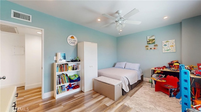 bedroom with baseboards, visible vents, wood finished floors, and recessed lighting