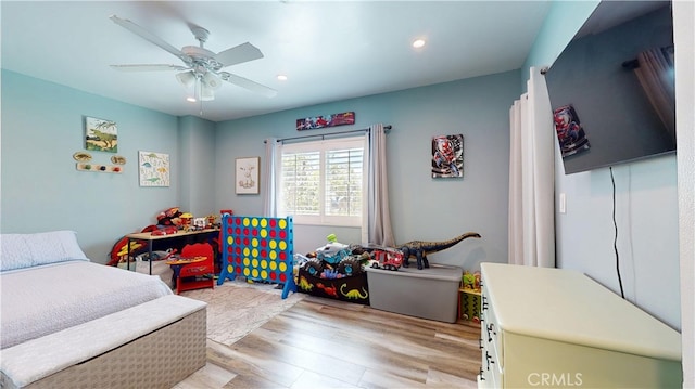 bedroom with recessed lighting, a ceiling fan, and light wood-style floors