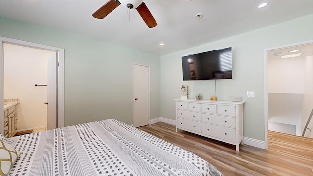 bedroom with recessed lighting, baseboards, and light wood finished floors