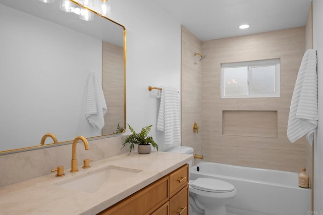 full bathroom featuring  shower combination, vanity, and toilet