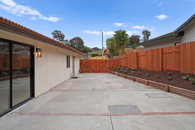 view of patio / terrace with fence and a gate