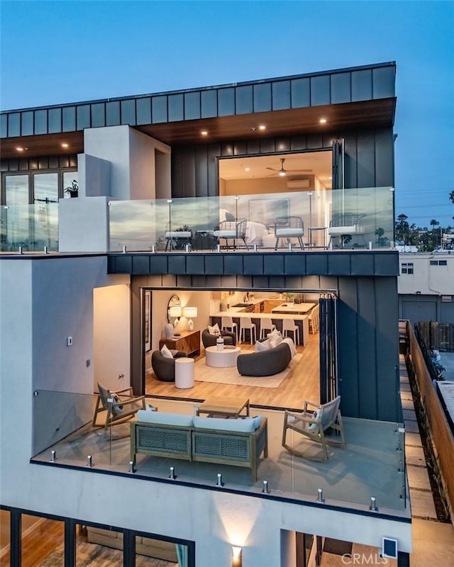 exterior space featuring an outdoor living space and a balcony