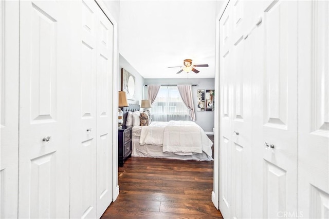 bedroom with ceiling fan and dark wood-style flooring