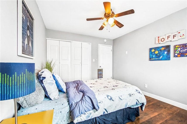 bedroom featuring a closet, ceiling fan, baseboards, and wood finished floors