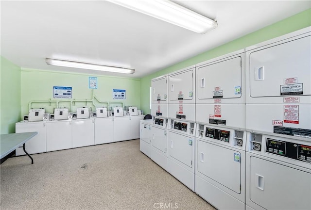 community laundry room featuring washing machine and dryer and stacked washer and clothes dryer