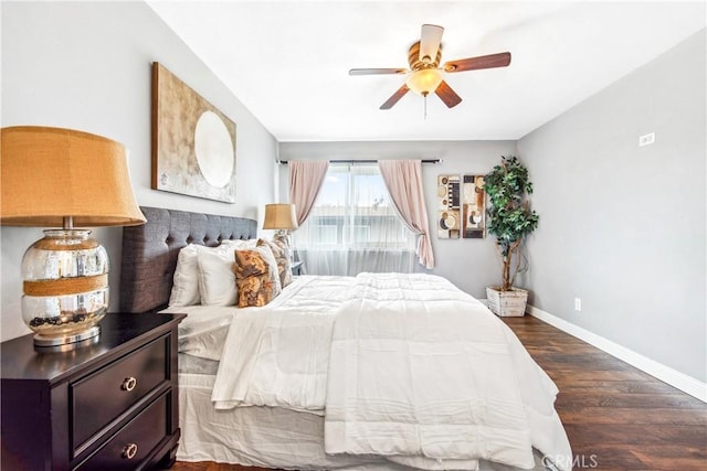 bedroom featuring dark wood-style flooring, ceiling fan, and baseboards