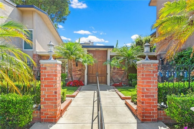 view of gate featuring fence