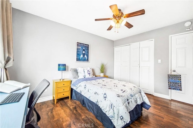 bedroom with a ceiling fan, a closet, baseboards, and wood finished floors