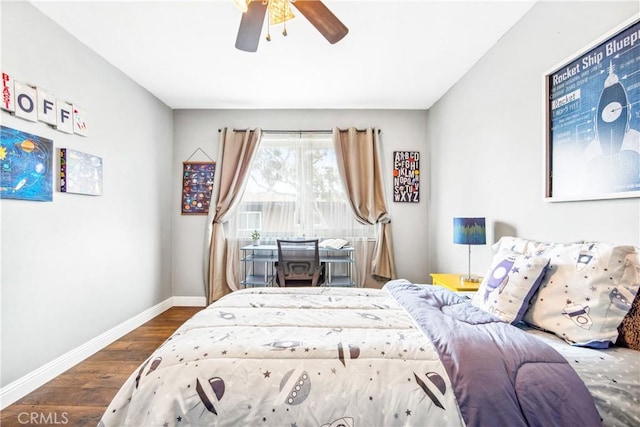 bedroom with wood finished floors, a ceiling fan, and baseboards