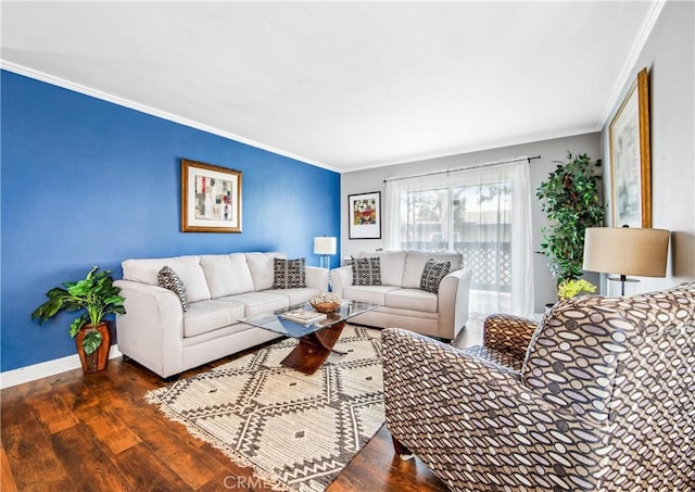 living area with baseboards, ornamental molding, and wood finished floors