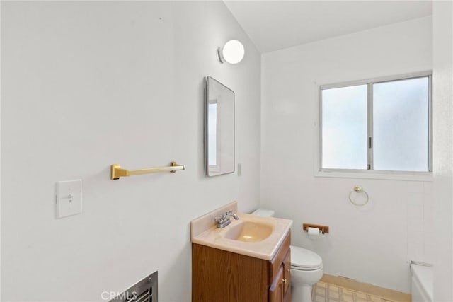 bathroom with tile patterned floors, toilet, and vanity