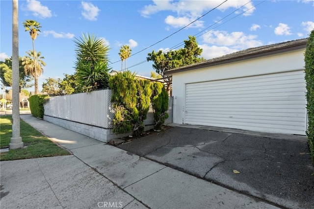 garage with fence