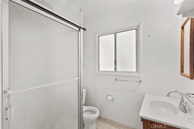 bathroom featuring toilet and vanity